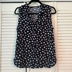 Black and white sleeveless blouse